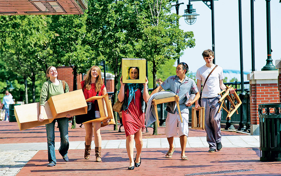 students-carrying-their-projects-to-studio